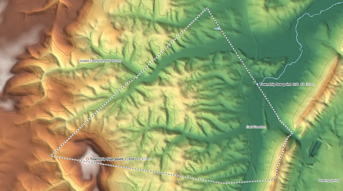 Topographic elevation map of Freedom Township, Pennsylvania, shaded from 990 ft on the northeast side to 2,860 ft on Ritchey Knob
