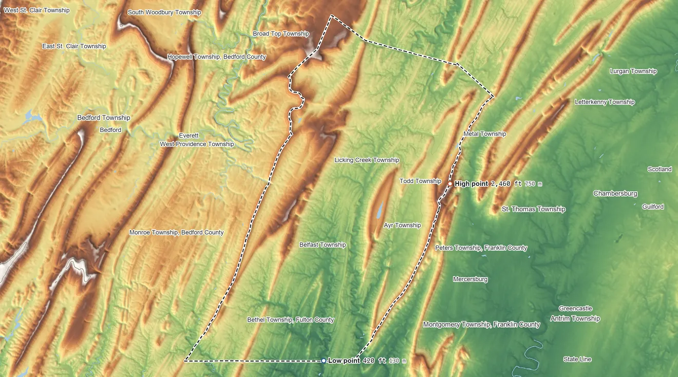 Topographic elevation map of Fulton County, Pennsylvania, shaded from 420 ft on the south side to 2,460 ft on Big Mountain