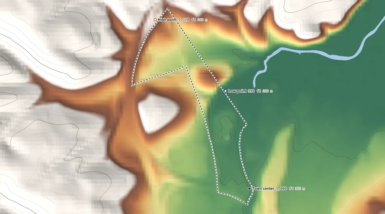 Topographic elevation map of Leamersville, Pennsylvania, shaded from 990 ft on the north side to 1,120 ft at the foot of the Tussey Mountain