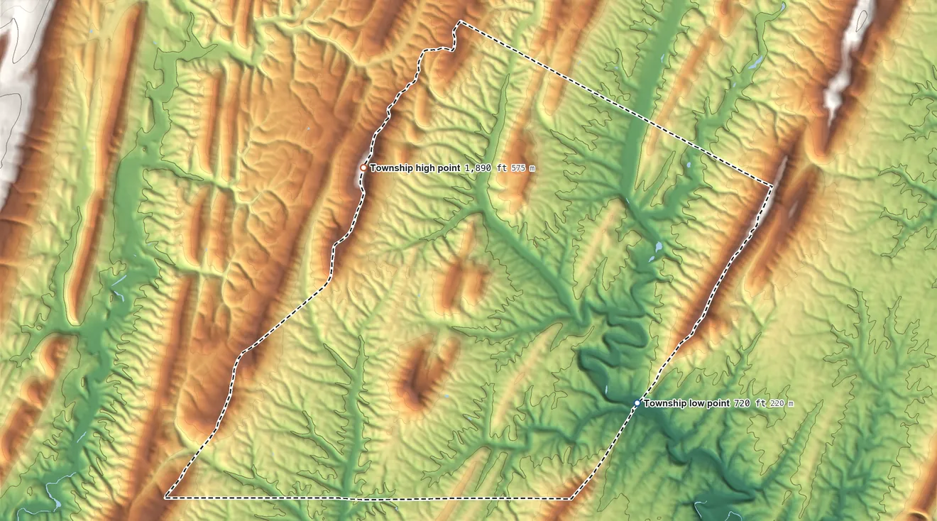 Topographic elevation map of Mann Township, Pennsylvania, shaded from 720 ft on the east side to 1,890 ft on Big Mountain