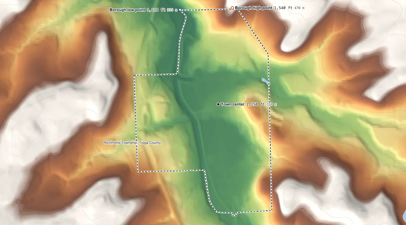 Topographic elevation map of Mansfield, Pennsylvania, shaded from 1,110 ft on the north side to 1,540 ft on the north side