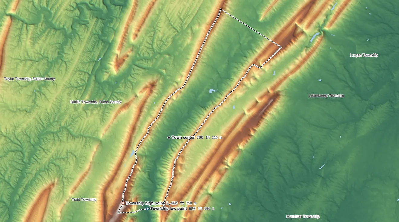 Topographic elevation map of Metal Township, Pennsylvania, shaded from 620 ft on the south side to 2,460 ft on Big Mountain