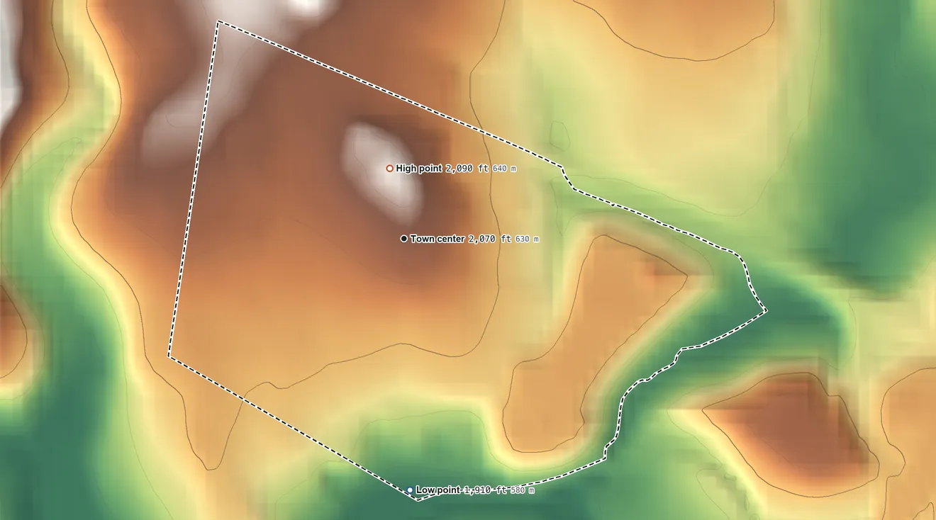 Topographic elevation map of Revloc, Pennsylvania, shaded from 1,910 ft on the south side to 2,090 ft near the middle