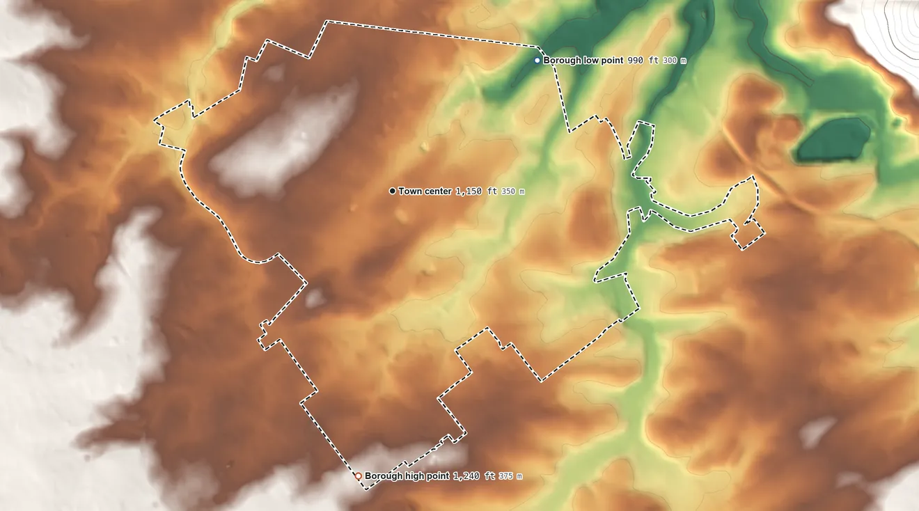 Topographic elevation map of State College, Pennsylvania, shaded from 990 ft on the northeast side to 1,240 ft on the south side