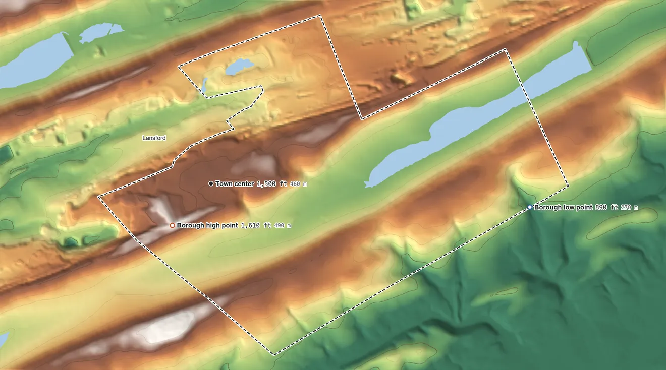 Topographic elevation map of Summit Hill, Pennsylvania, shaded from 890 ft on the east side to 1,610 ft on Pisgah Mountain