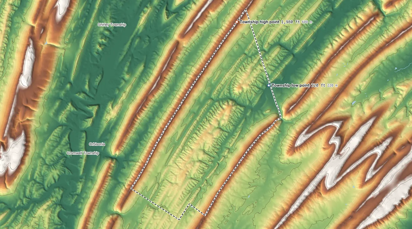 Topographic elevation map of Tell Township, Pennsylvania, shaded from 720 ft on the northeast side to 1,980 ft on the north side