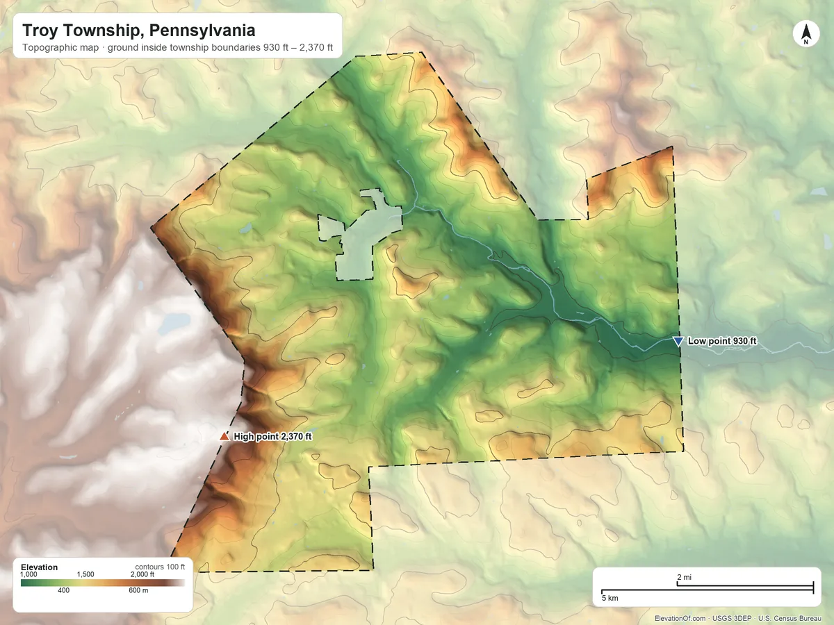 Topographic elevation map of Troy Township, Pennsylvania, shaded from 930 ft on the east side to 2,370 ft on the southwest side