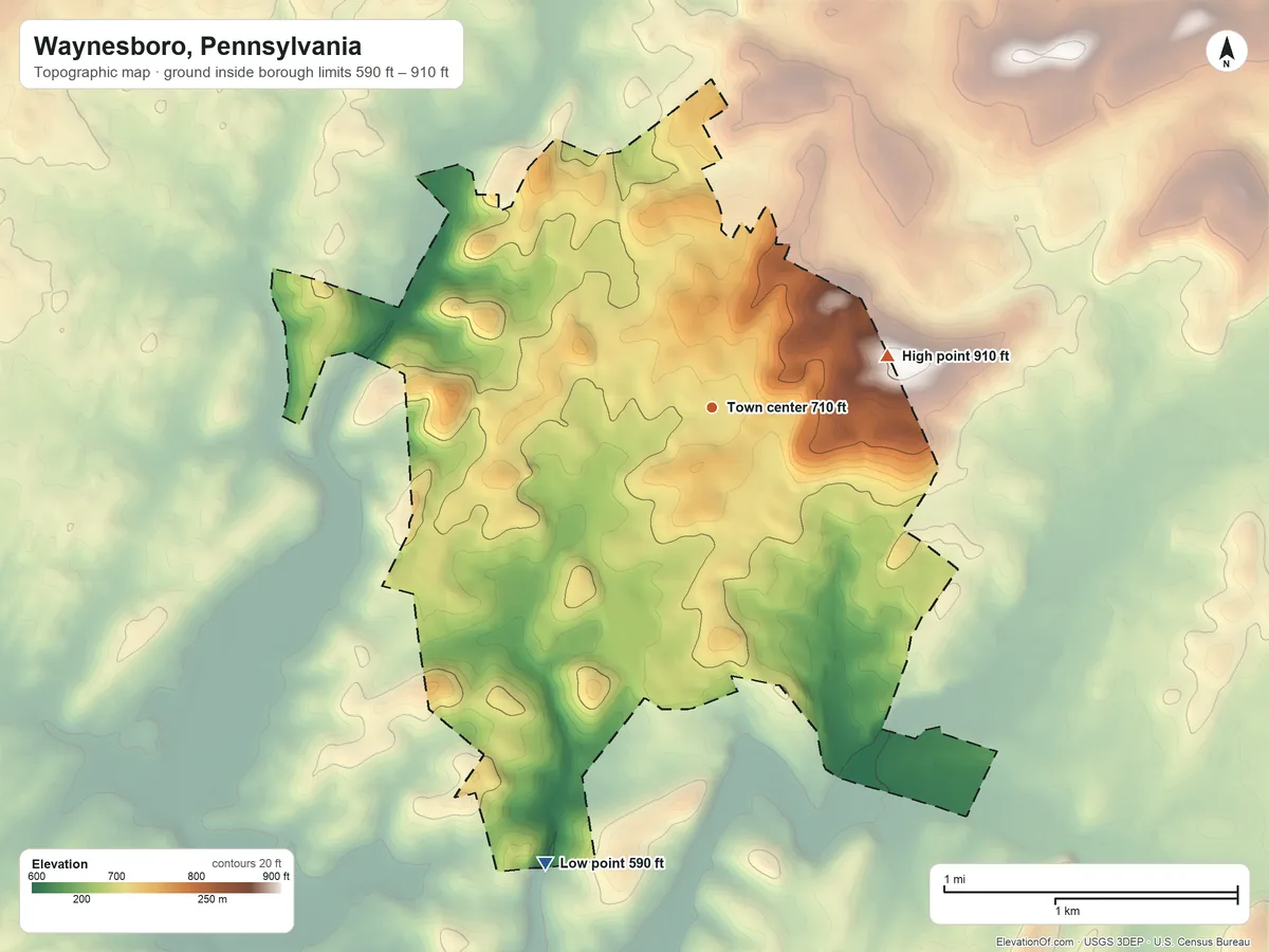 Topographic elevation map of Waynesboro, Pennsylvania, shaded from 590 ft on the south side to 910 ft on the east side