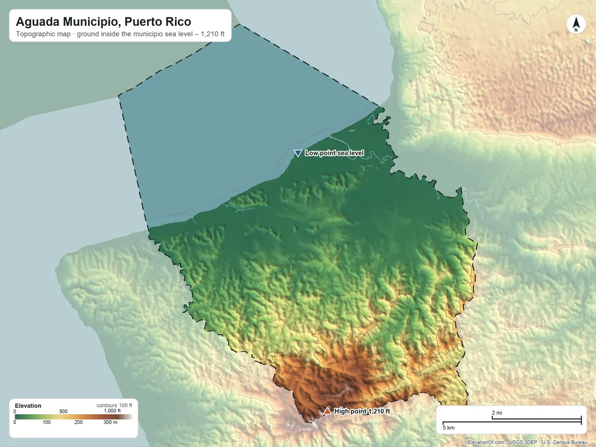 Topographic elevation map of Aguada Municipio, Puerto Rico, shaded from sea level on the Océano Atlántico to 1,210 ft on the south side
