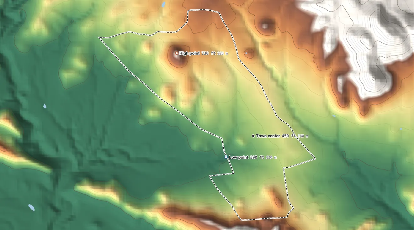 Topographic elevation map of Los Llanos, Puerto Rico, shaded from 390 ft on the southwest side to 730 ft at the foot of the Cerros de Santini