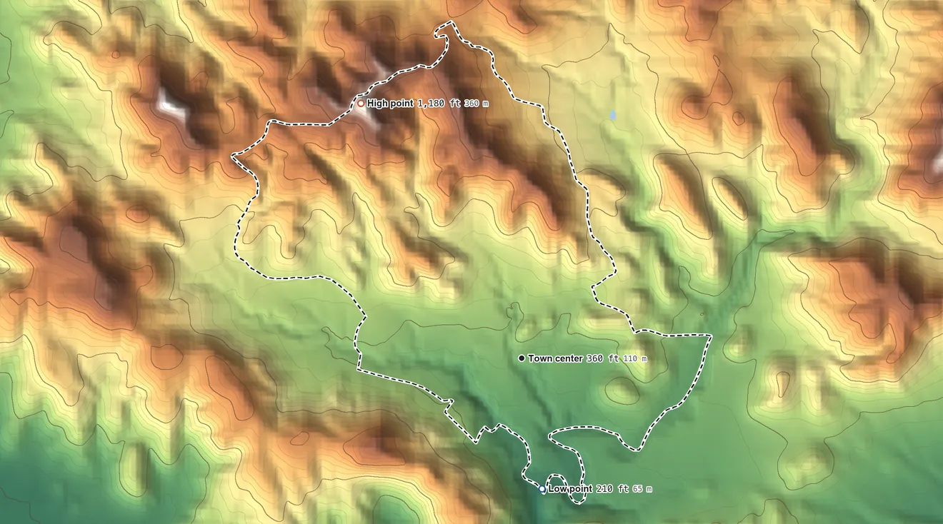Topographic elevation map of Mariano Colón, Puerto Rico, shaded from 210 ft on the south side to 1,180 ft at the foot of the Cerros de Santini