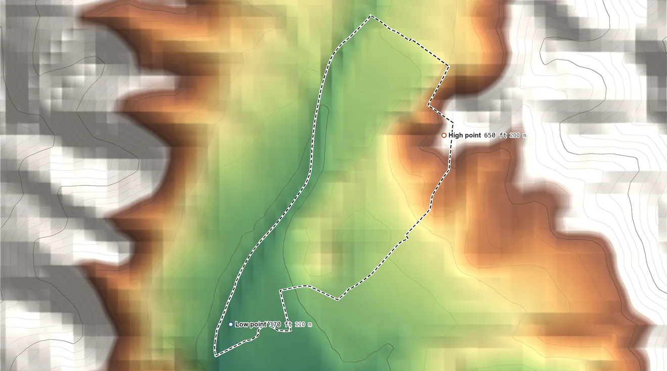 Topographic elevation map of Parcelas Mandry, Puerto Rico, shaded from 370 ft on the southwest side to 650 ft at the foot of the Cordillera Central
