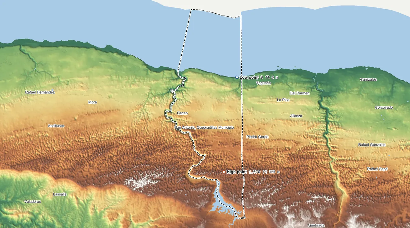 Topographic elevation map of Quebradillas Municipio, Puerto Rico, shaded from sea level on the Océano Atlántico to 1,070 ft on the south side