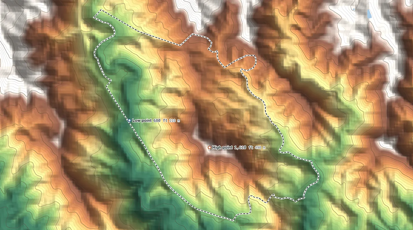 Topographic elevation map of Tibes, Puerto Rico, shaded from 680 ft on the west side to 1,610 ft at the foot of the Montes de Barina