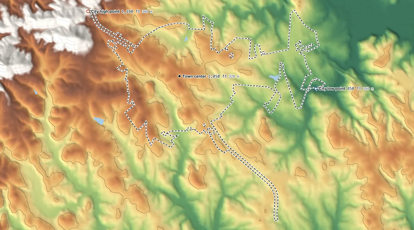 Topographic elevation map of Landrum, South Carolina, shaded from 850 ft on the east side to 1,180 ft at the foot of the Saluda Mountains