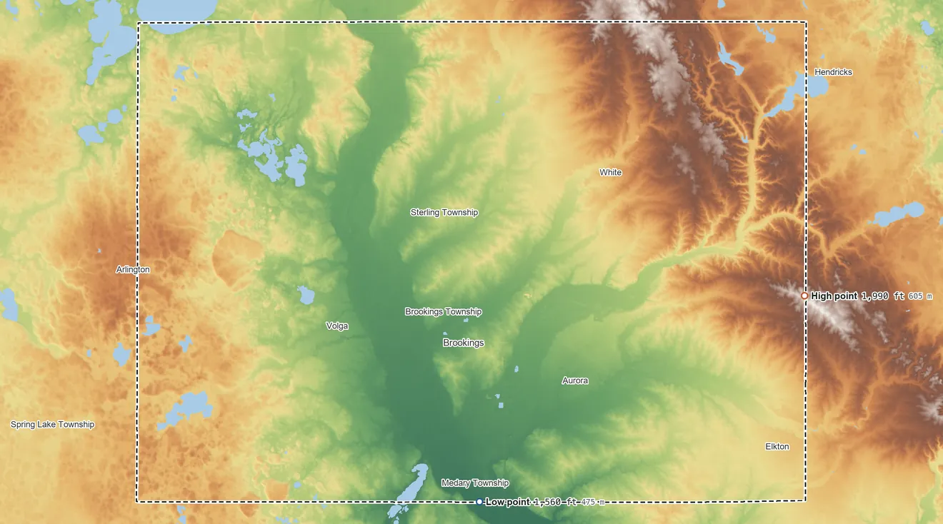 Topographic elevation map of Brookings County, South Dakota, shaded from 1,560 ft on the south side to 1,990 ft on the east side