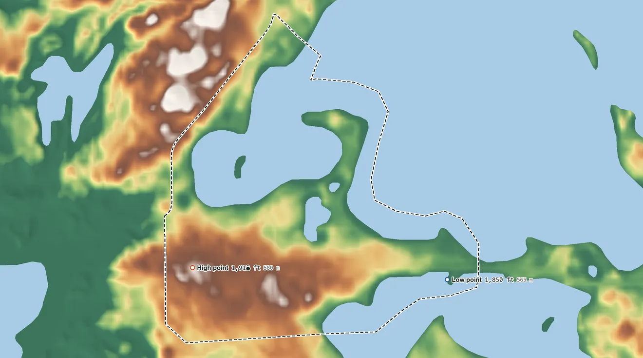 Topographic elevation map of Enemy Swim, South Dakota, shaded from 1,850 ft on the east side to 1,910 ft on the west side