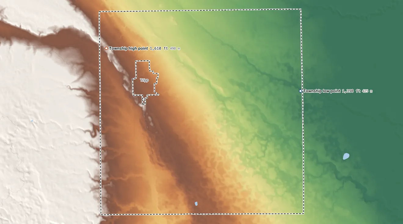 Topographic elevation map of Fair Township, South Dakota, shaded from 1,390 ft on the southeast side to 1,610 ft on the west side