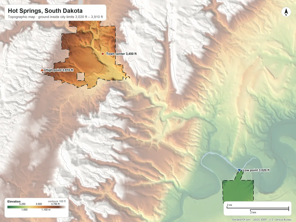 Topographic elevation map of Hot Springs, South Dakota, shaded from 3,020 ft on the southeast side to 3,910 ft at the foot of the Seven Sisters Range