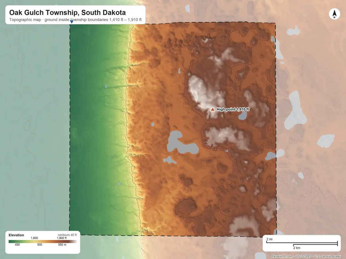 Topographic elevation map of Oak Gulch Township, South Dakota, shaded from 1,410 ft on the northwest side to 1,910 ft on the northeast side