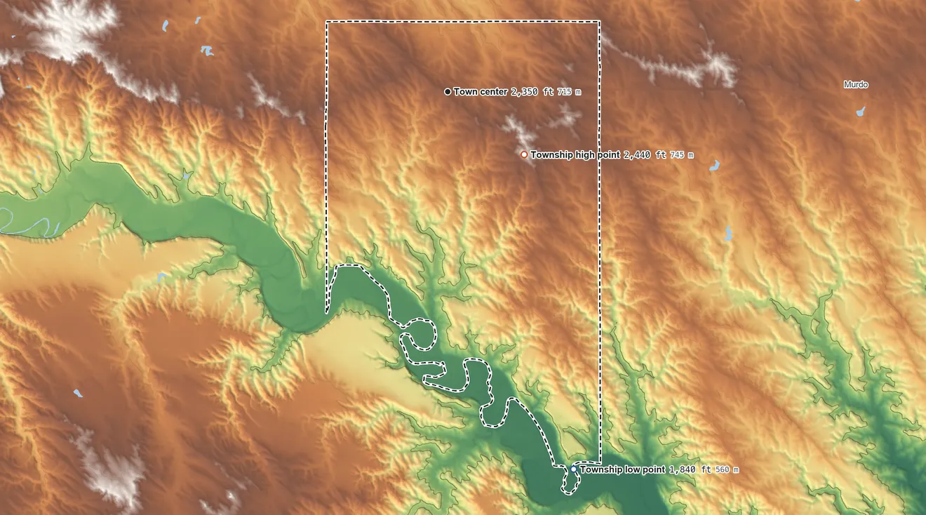 Topographic elevation map of Okaton Township, South Dakota, shaded from 1,840 ft on the south side to 2,440 ft on the southeast side