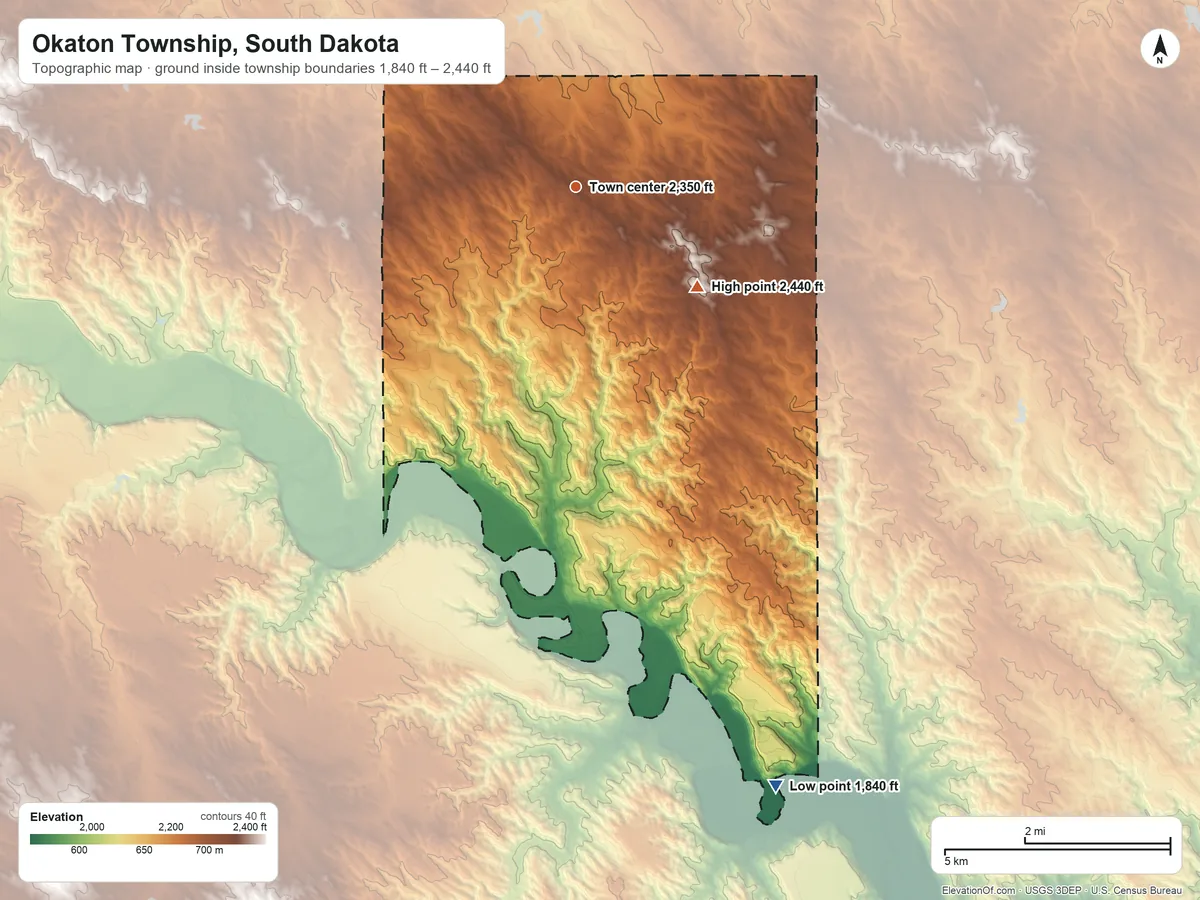 Topographic elevation map of Okaton Township, South Dakota, shaded from 1,840 ft on the south side to 2,440 ft on the southeast side