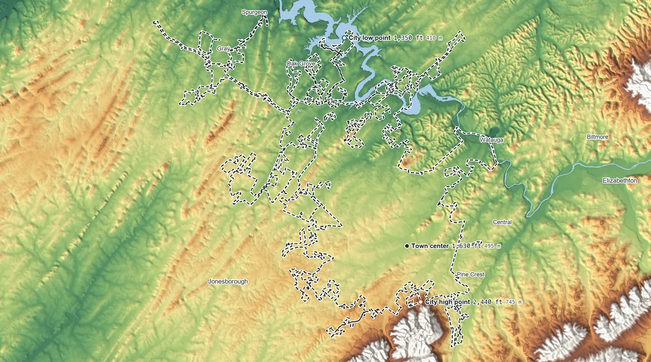 Topographic elevation map of Johnson City, Tennessee, shaded from 1,350 ft on the north side to 2,440 ft on the south edge, below higher ground just outside