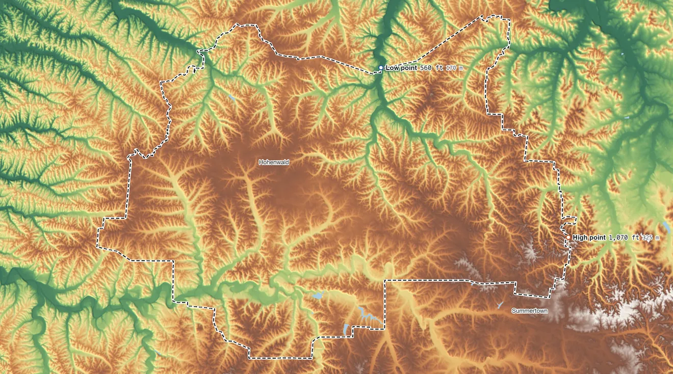 Topographic elevation map of Lewis County, Tennessee, shaded from 560 ft on the north side to 1,070 ft on the east side