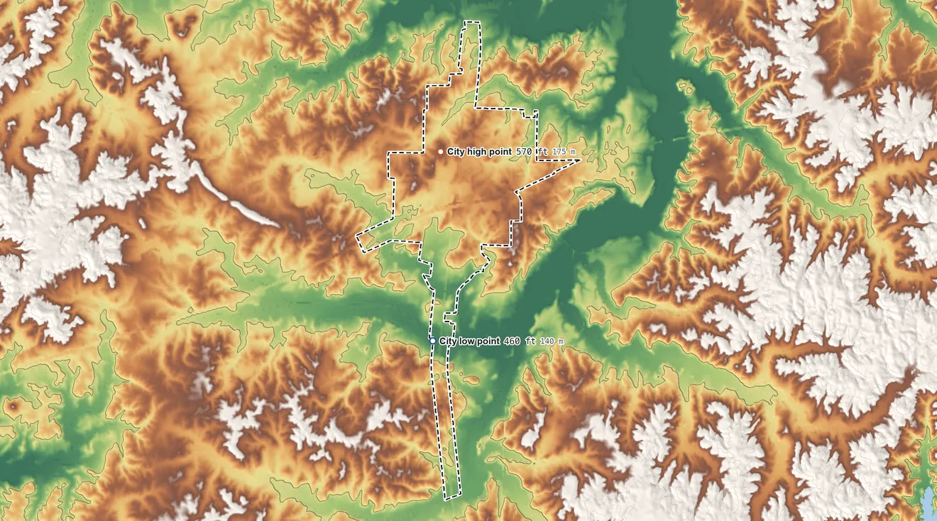 Topographic elevation map of Parker's Crossroads, Tennessee, shaded from 460 ft on the southwest side to 570 ft on the north side