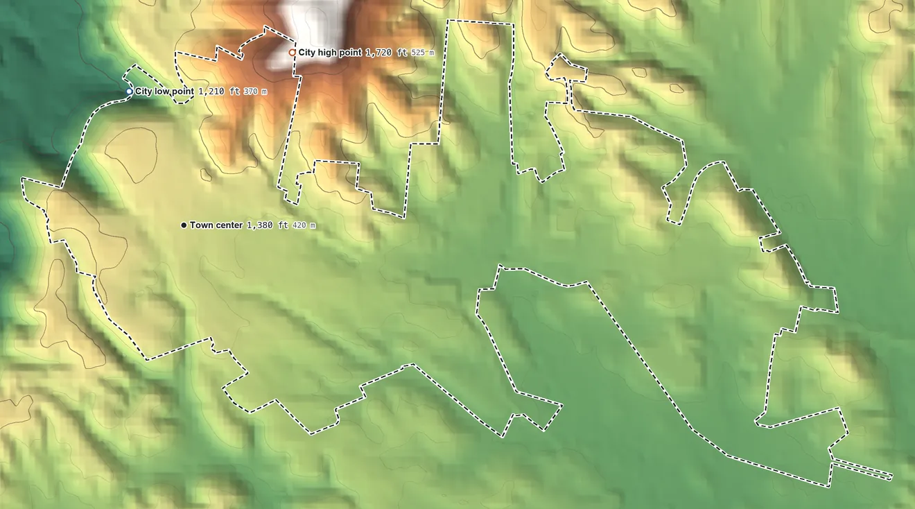 Topographic elevation map of Wartburg, Tennessee, shaded from 1,210 ft on the north side to 1,720 ft at the foot of the Crab Orchard Mountains
