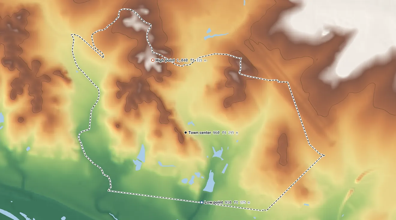 Topographic elevation map of Cienegas Terrace, Texas, shaded from 910 ft on the south side to 1,040 ft on the northwest side