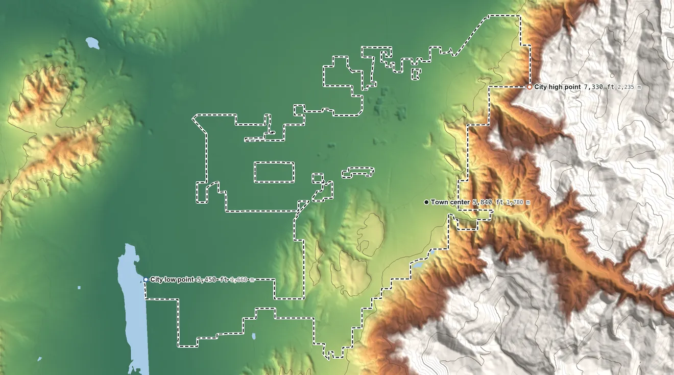 Topographic elevation map of Cedar City, Utah, shaded from 5,450 ft on the west side to 7,330 ft on the northeast edge, below higher ground just outside