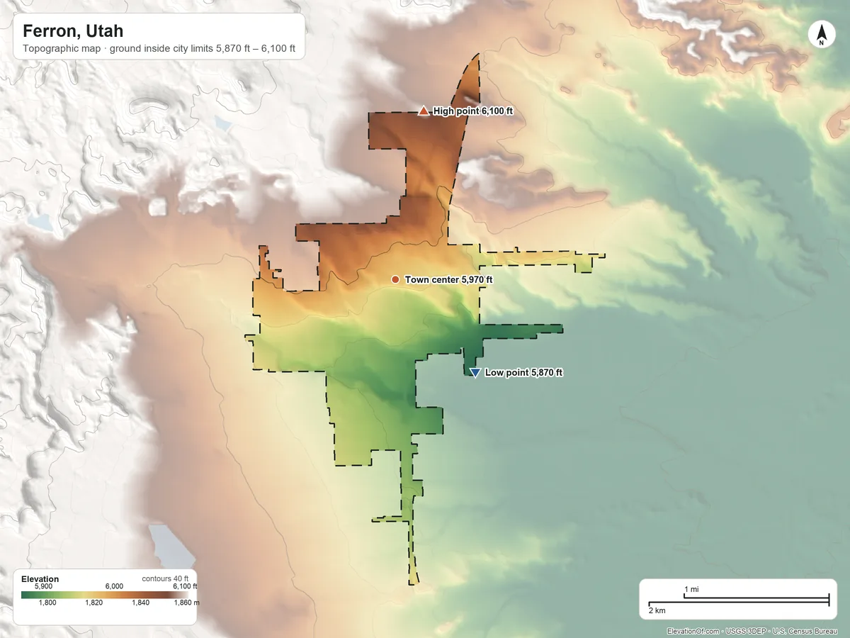 Topographic elevation map of Ferron, Utah, shaded from 5,870 ft on the southeast side to 6,100 ft on the north edge, below higher ground just outside