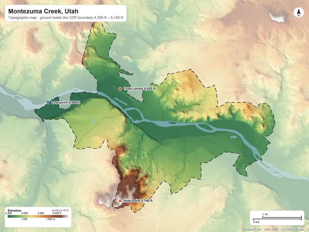 Topographic elevation map of Montezuma Creek, Utah, shaded from 4,390 ft on the west side to 5,140 ft on Flat Top Mountain