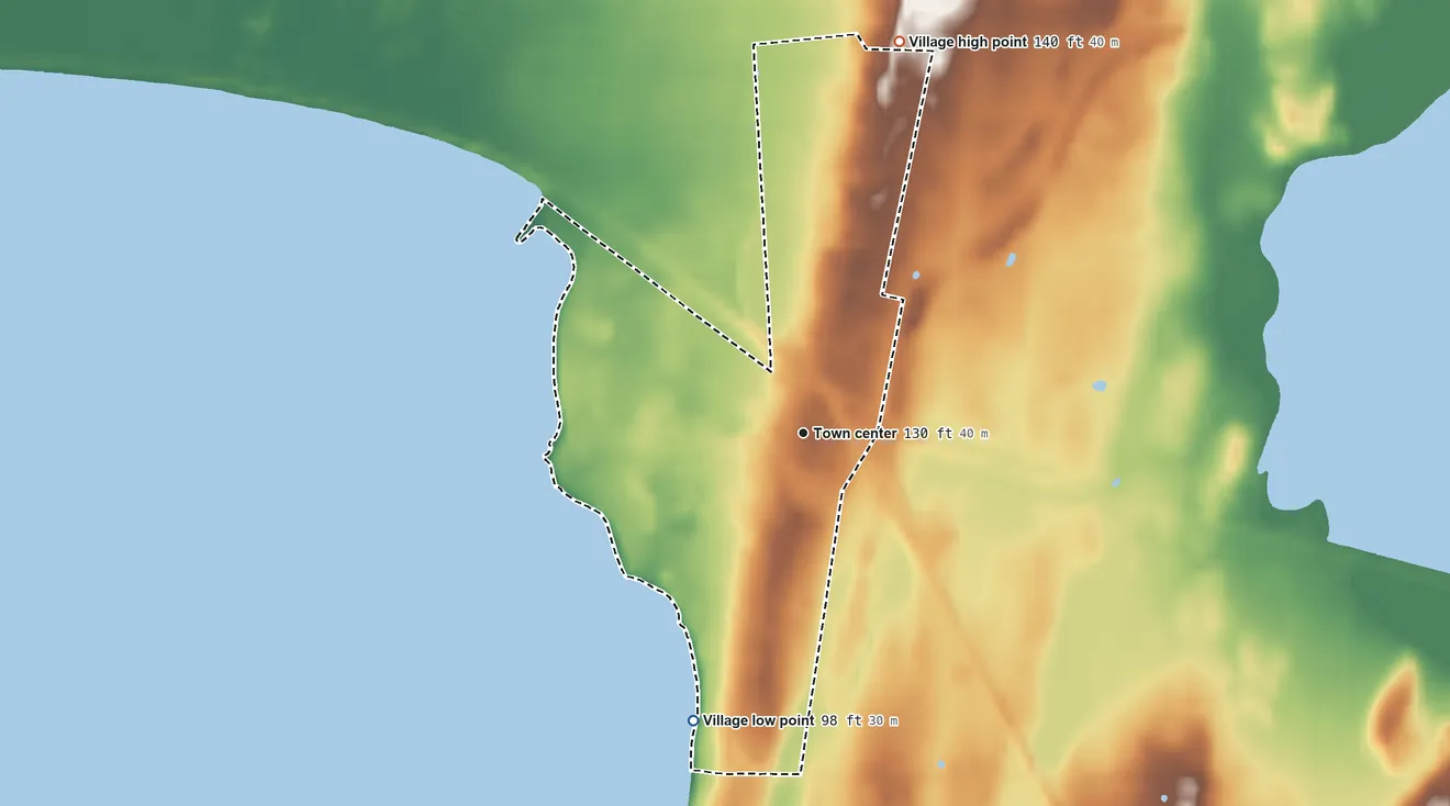 Topographic elevation map of Village of Alburgh, Vermont, shaded from 98 ft on the south side to 140 ft on the north side