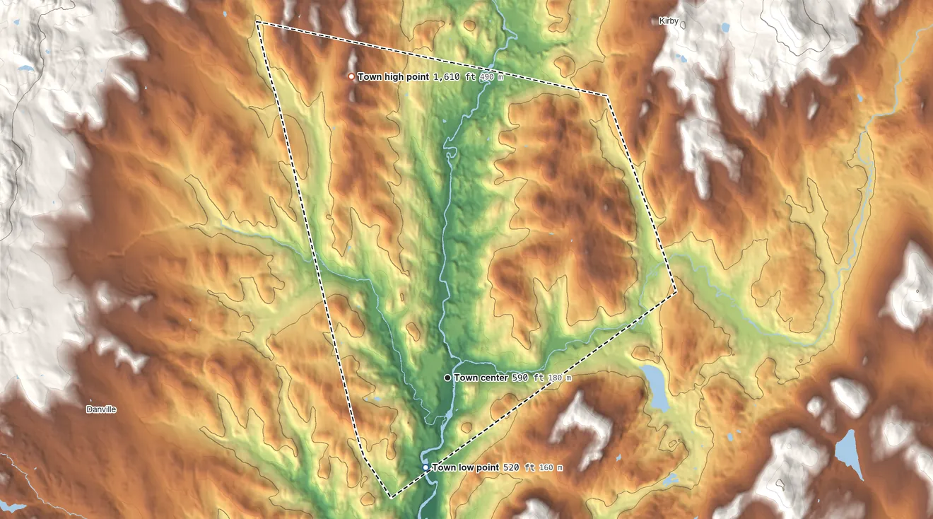 Topographic elevation map of St. Johnsbury, Vermont, shaded from 520 ft on the south side to 1,610 ft on the north side