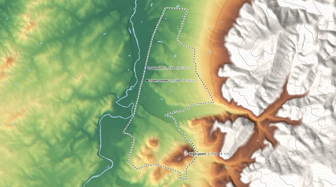 Topographic elevation map of Dooms, Virginia, shaded from 1,240 ft near the middle to 1,710 ft on Mikes Knob