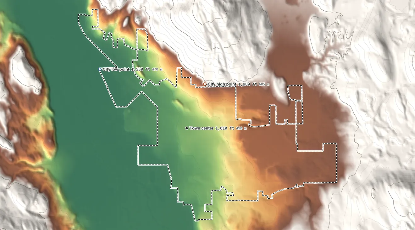 Topographic elevation map of Colville, Washington, shaded from 1,550 ft on the northwest side to 1,980 ft at the foot of the Huckleberry Range