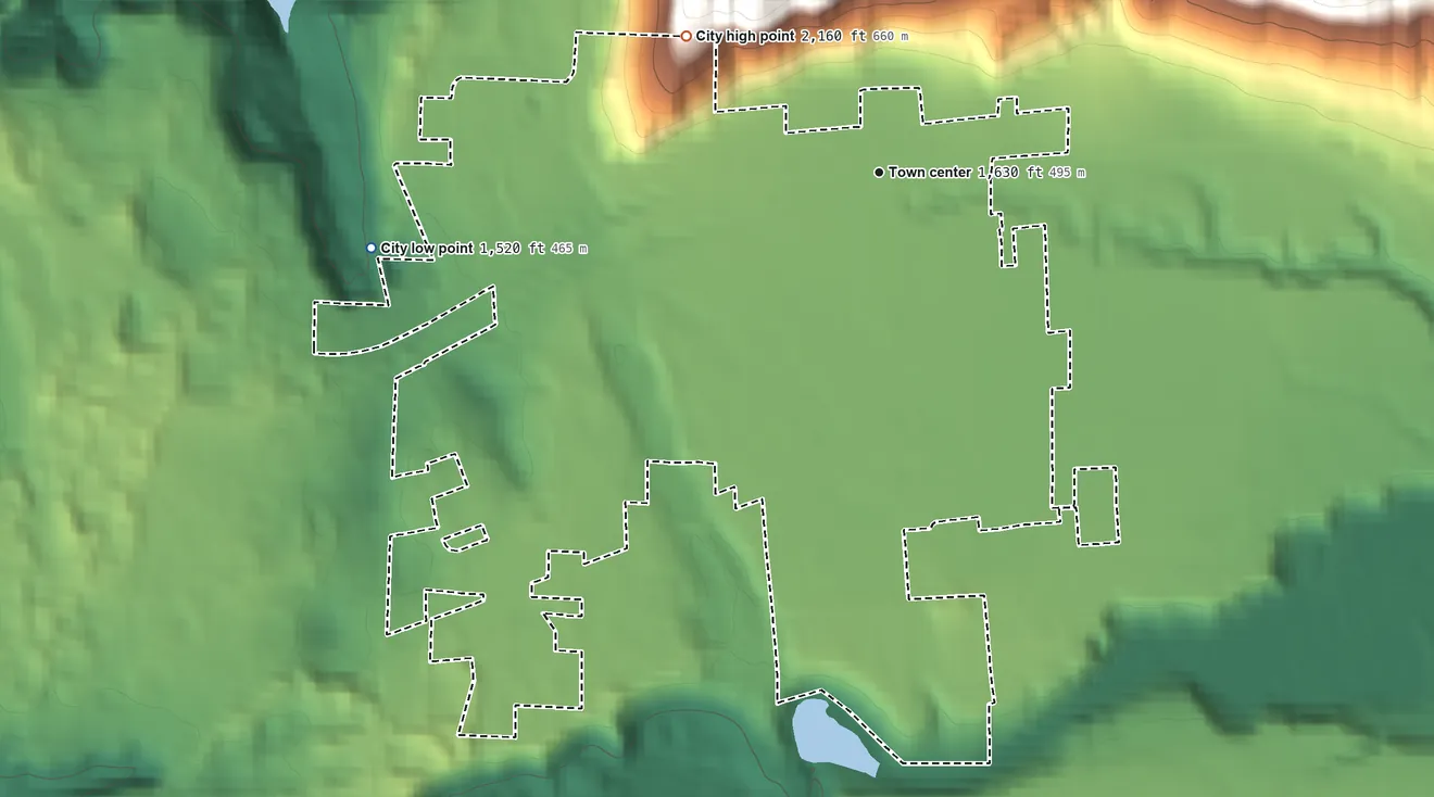 Topographic elevation map of Kettle Falls, Washington, shaded from 1,520 ft on the west side to 2,160 ft at the foot of the Huckleberry Range