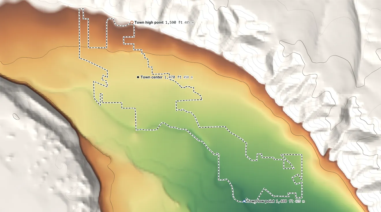 Topographic elevation map of Naches, Washington, shaded from 1,400 ft on the southeast side to 1,590 ft on the north edge, below higher ground just outside