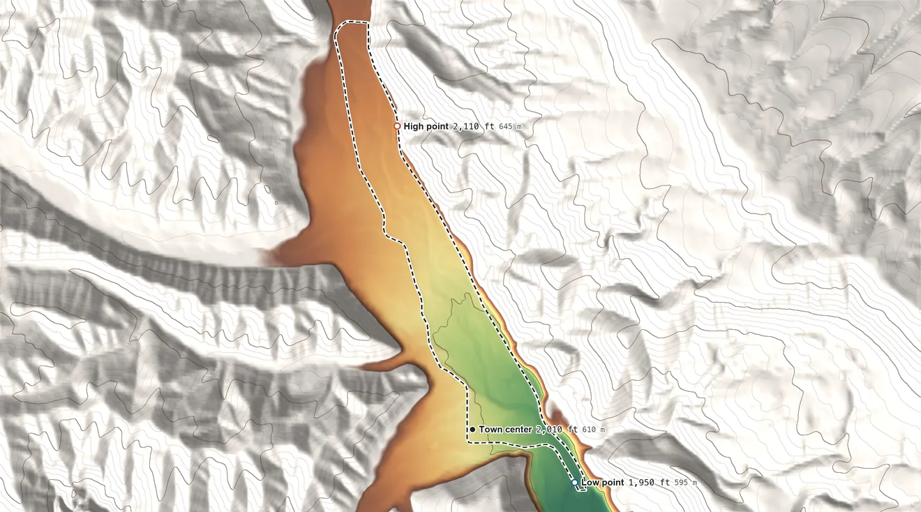 Topographic elevation map of Nile, Washington, shaded from 1,950 ft on the southeast side to 2,110 ft on the north edge, below higher ground just outside
