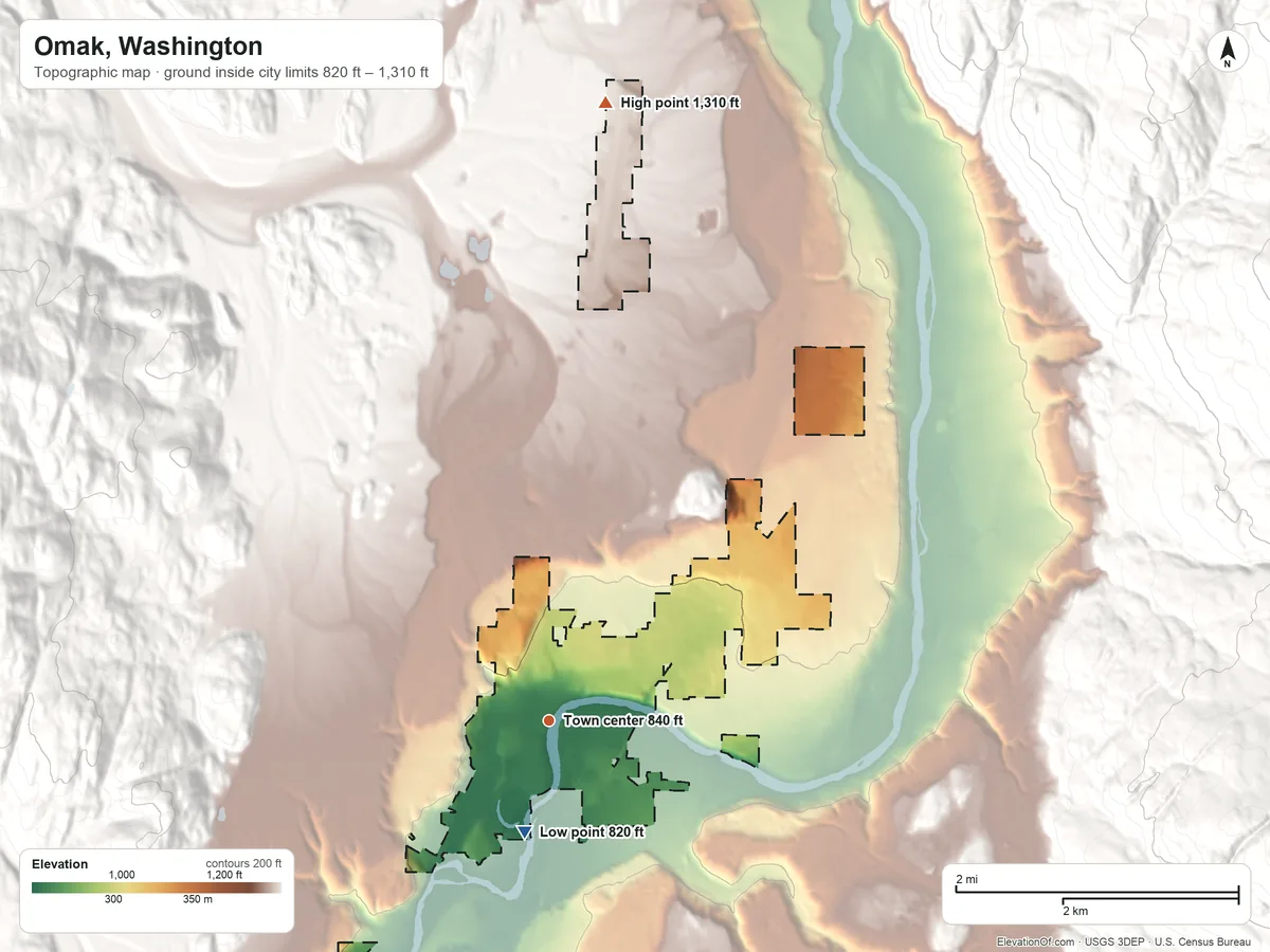 Topographic elevation map of Omak, Washington, shaded from 820 ft on the south side to 1,310 ft on the north side