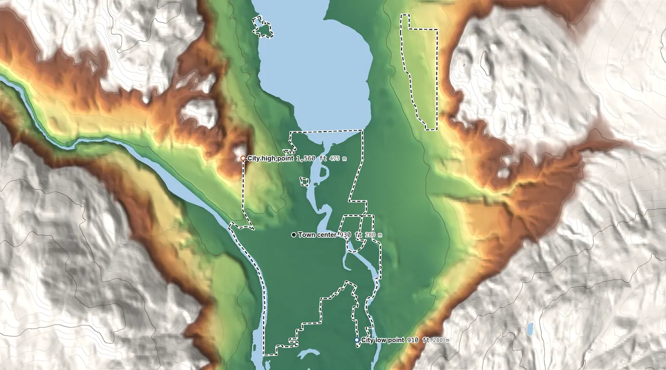 Topographic elevation map of Oroville, Washington, shaded from 910 ft on the southeast side to 1,560 ft on the northwest edge, below higher ground just outside