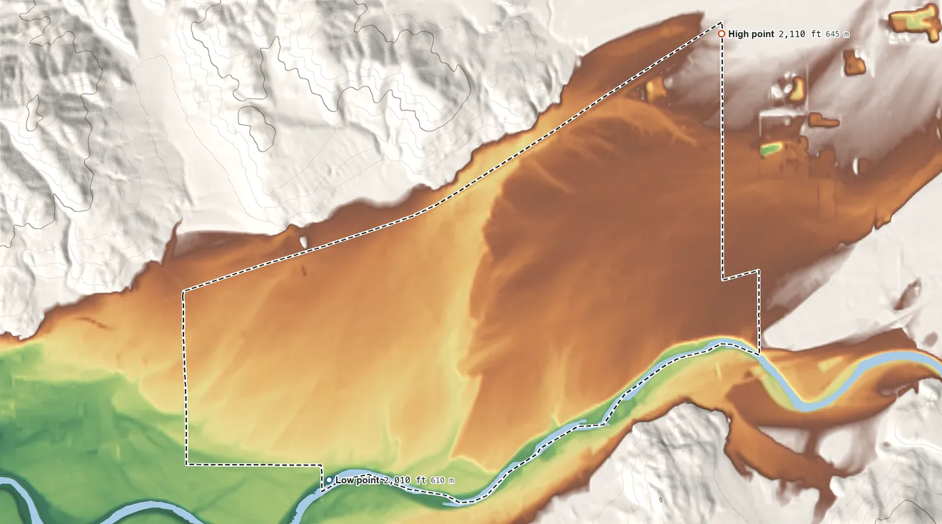 Topographic elevation map of Otis Orchards-East Farms, Washington, shaded from 2,010 ft on the southwest side to 2,110 ft on the northeast edge, below higher ground just outside