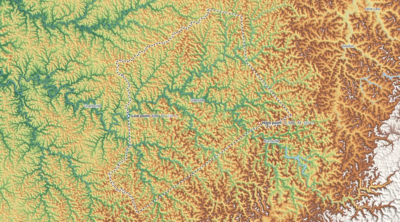Topographic elevation map of Gilmer County, West Virginia, shaded from 680 ft on the west side to 1,580 ft on the east side