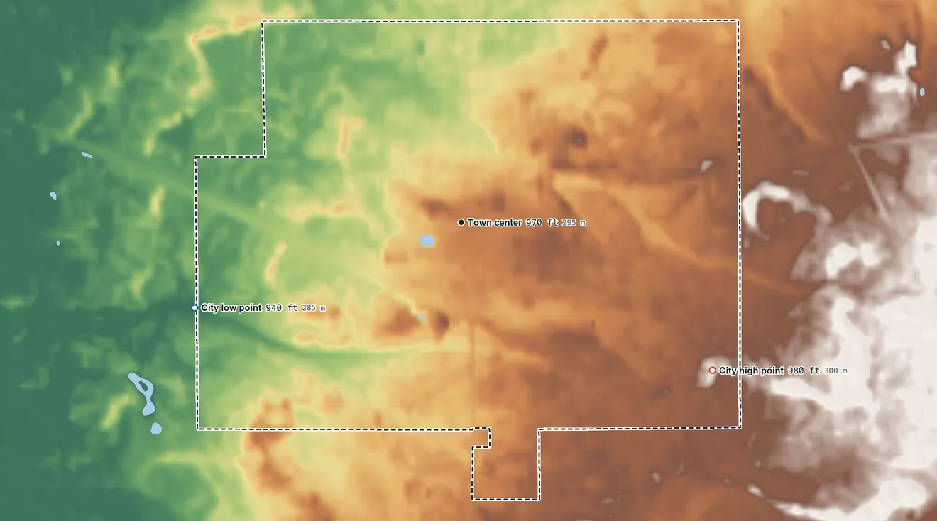 Topographic elevation map of Adams, Wisconsin, shaded from 940 ft on the west side to 980 ft on the southeast side
