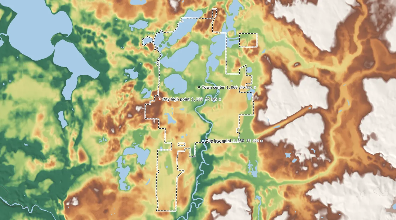 Topographic elevation map of Amery, Wisconsin, shaded from 1,050 ft on the south side to 1,130 ft on the west side