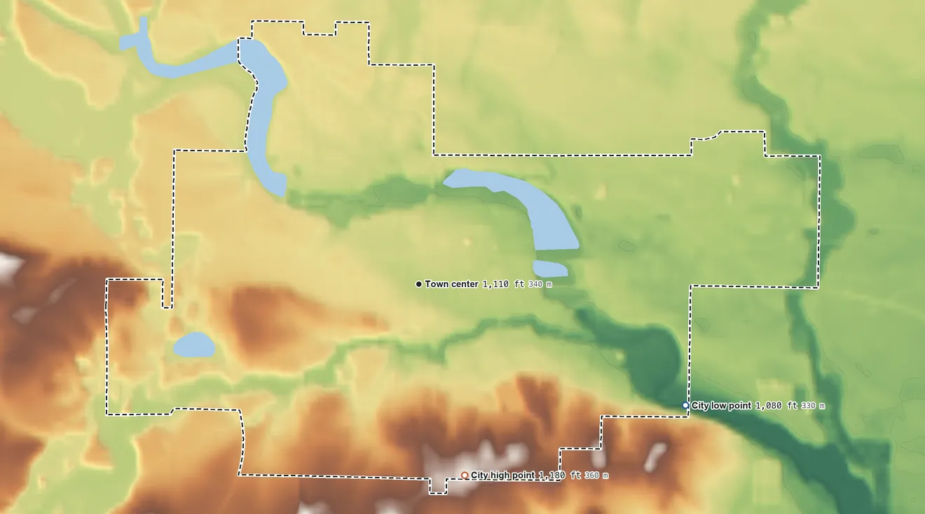 Topographic elevation map of Barron, Wisconsin, shaded from 1,080 ft on the southeast side to 1,180 ft on the south side