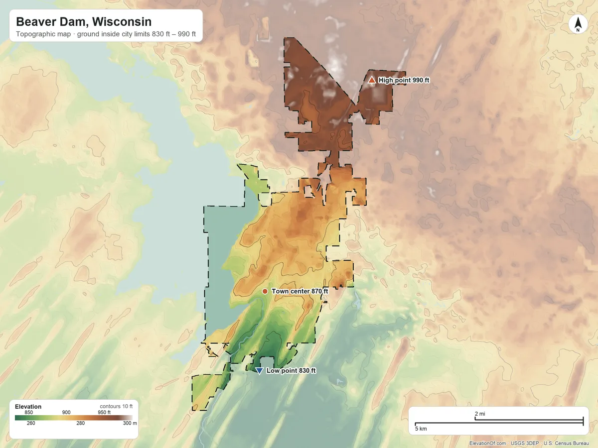Topographic elevation map of Beaver Dam, Wisconsin, shaded from 830 ft on the south side to 990 ft on the northeast side