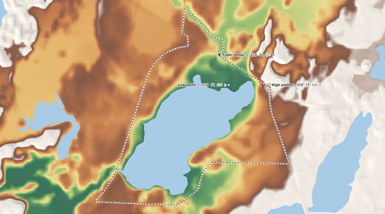 Topographic elevation map of Clam Lake, Wisconsin, shaded from 1,410 ft on the south side to 1,450 ft on the southeast side
